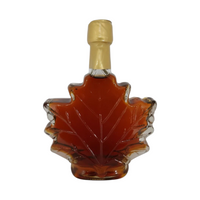 Doodle's Sugarbush, LLC 250ml pure Michigan maple syrup in a decorative maple leaf shaped glass bottle with gold seal
